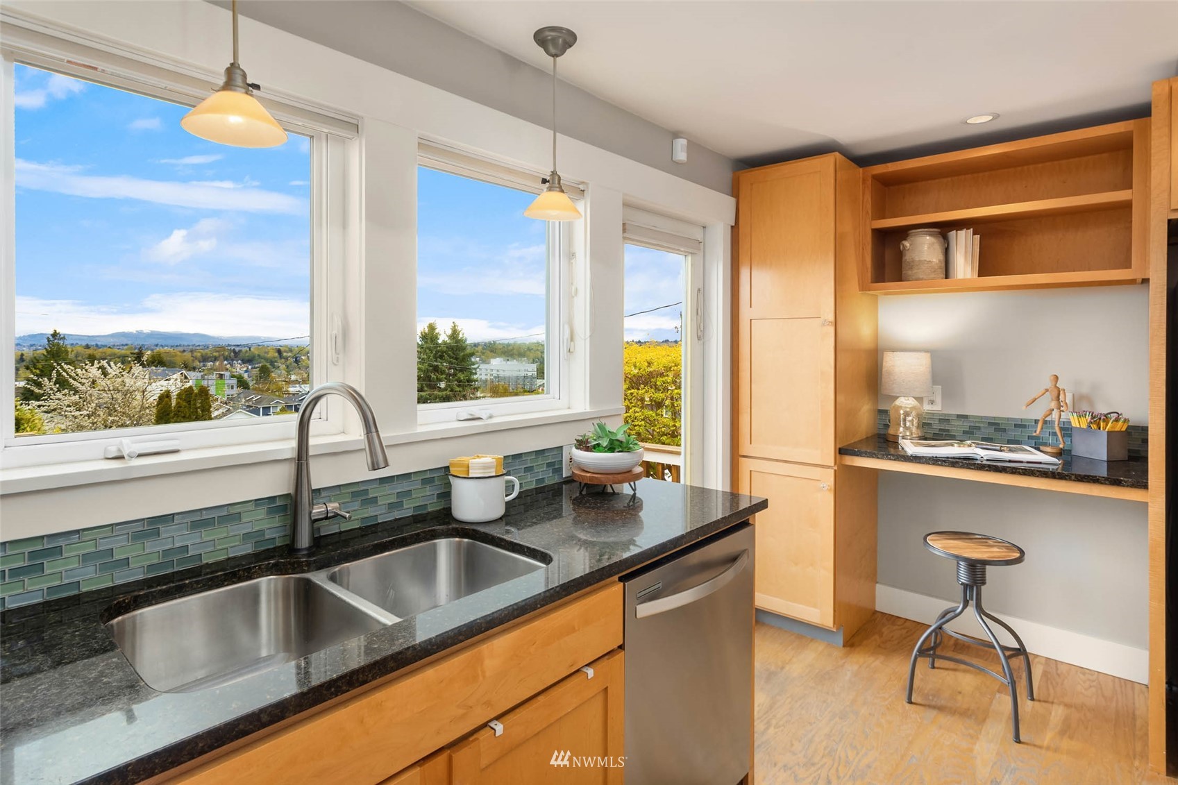 4110 38th Avenue Southwest Seattle, WA 98126 - Photo 11 of 29 a kitchen counter top space with granite countertop a sink and a counter top space