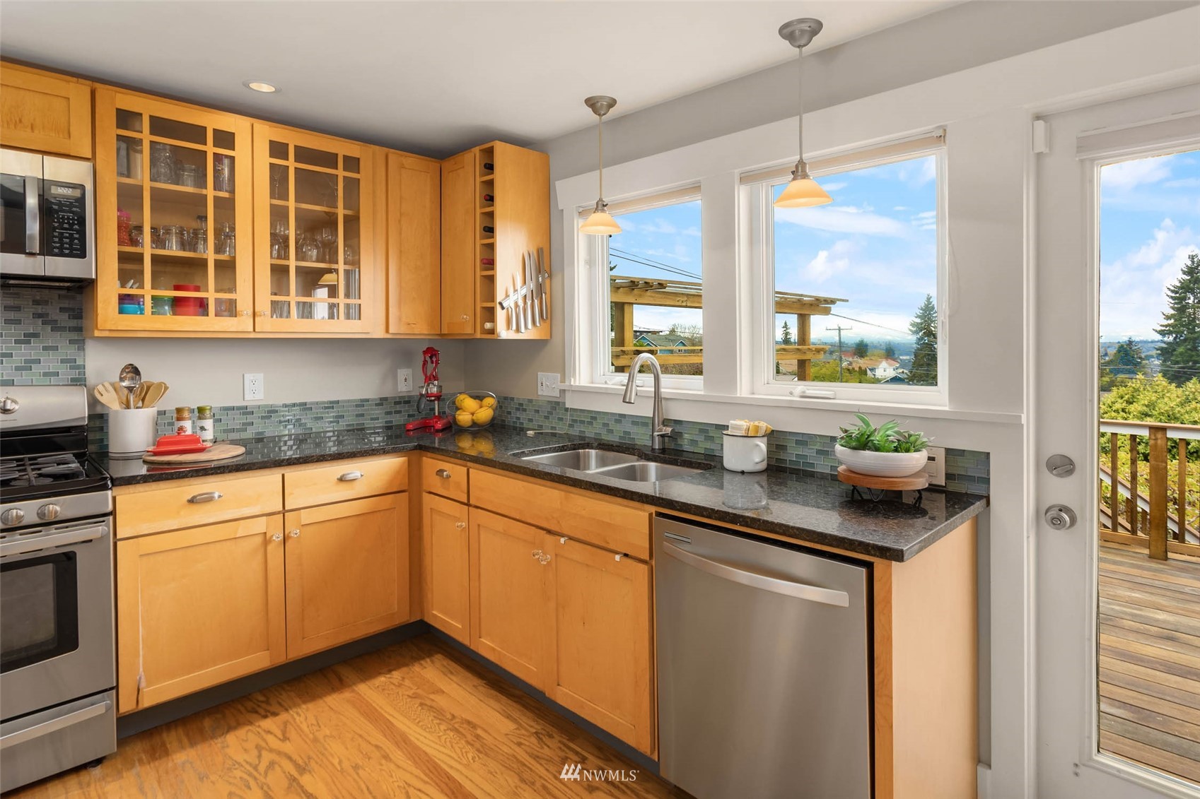 4110 38th Avenue Southwest Seattle, WA 98126 - Photo 12 of 29 a kitchen with stainless steel appliances a sink and cabinets