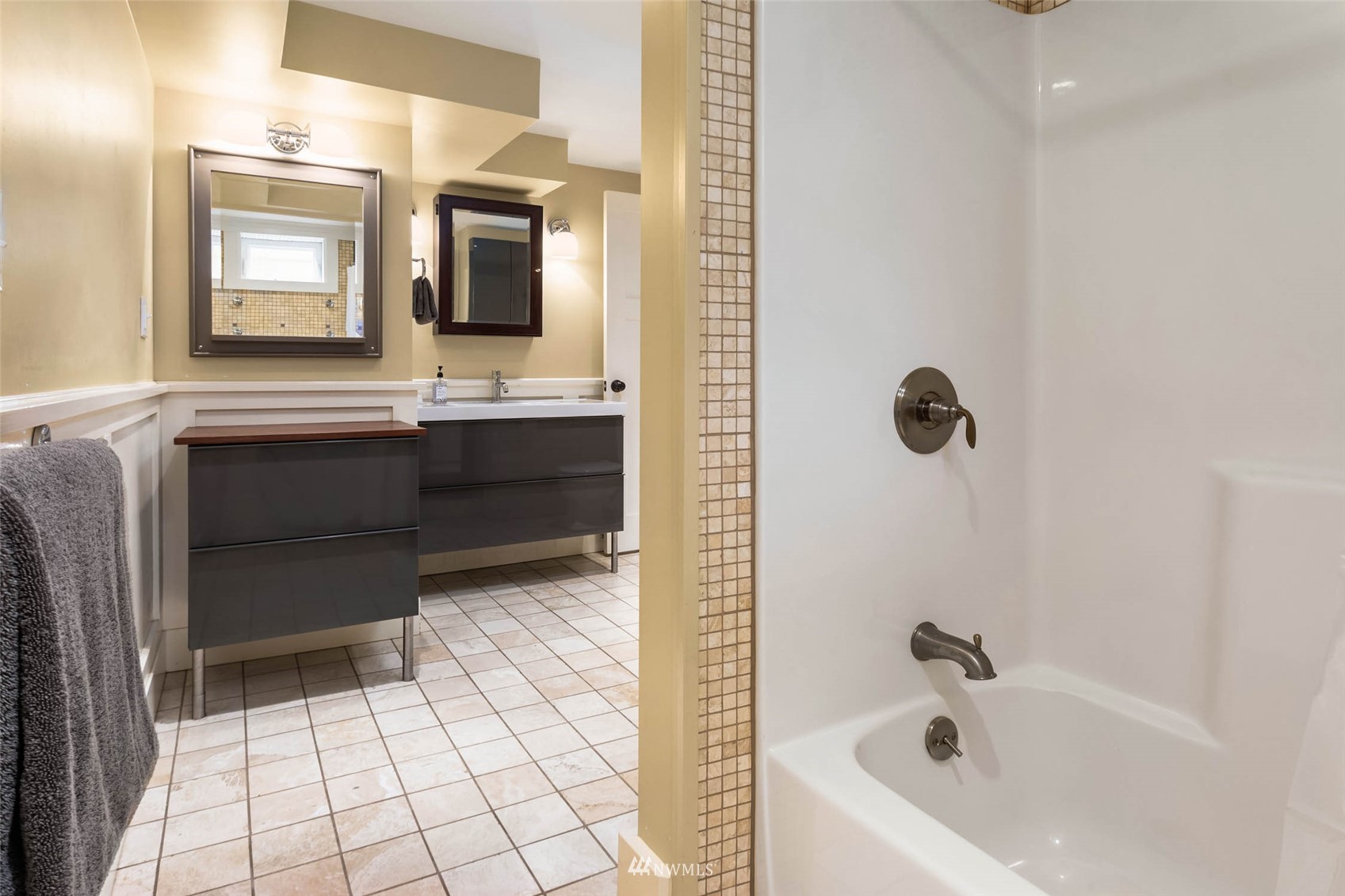 4110 38th Avenue Southwest Seattle, WA 98126 - Photo 20 of 29 a bathroom with a bathtub sink and mirror