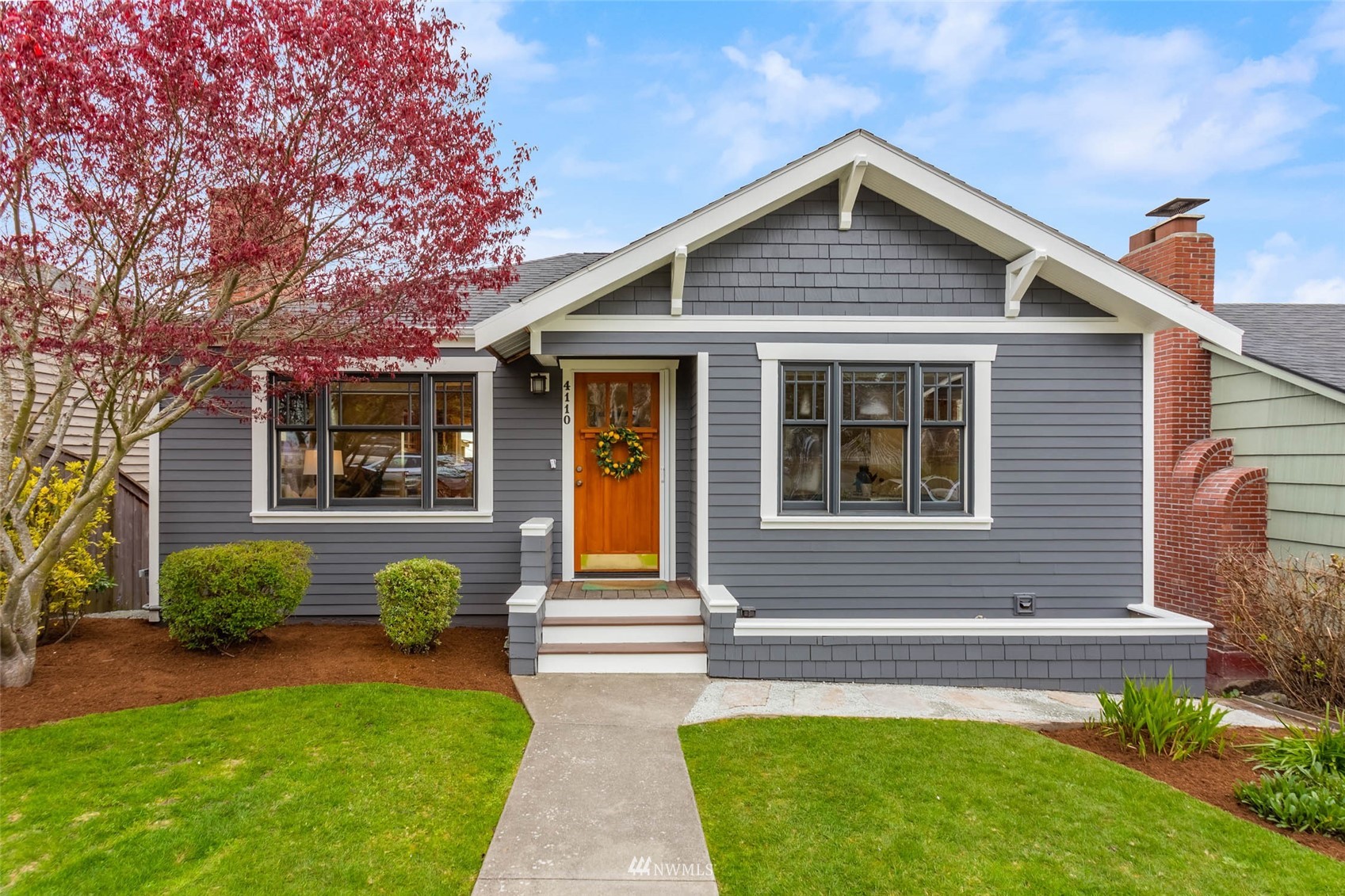 4110 38th Avenue Southwest Seattle, WA 98126 - Photo 2 of 29 a front view of a house with garden