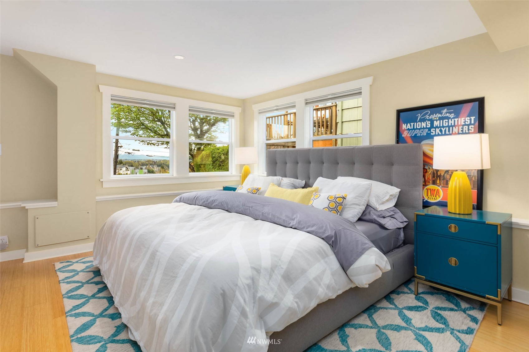 4110 38th Avenue Southwest Seattle, WA 98126 - Photo 21 of 29 a bed sitting in a bedroom next to a window