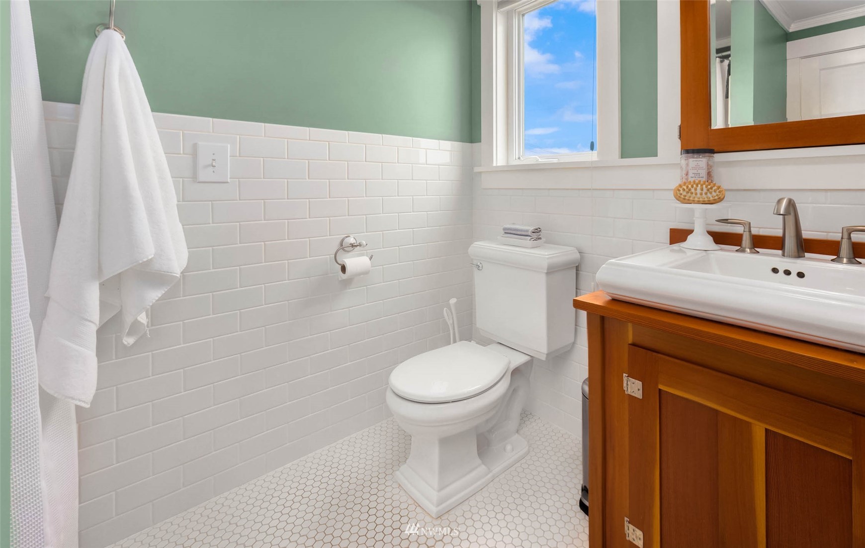 4110 38th Avenue Southwest Seattle, WA 98126 - Photo 23 of 29 a bathroom with a sink toilet and a mirror