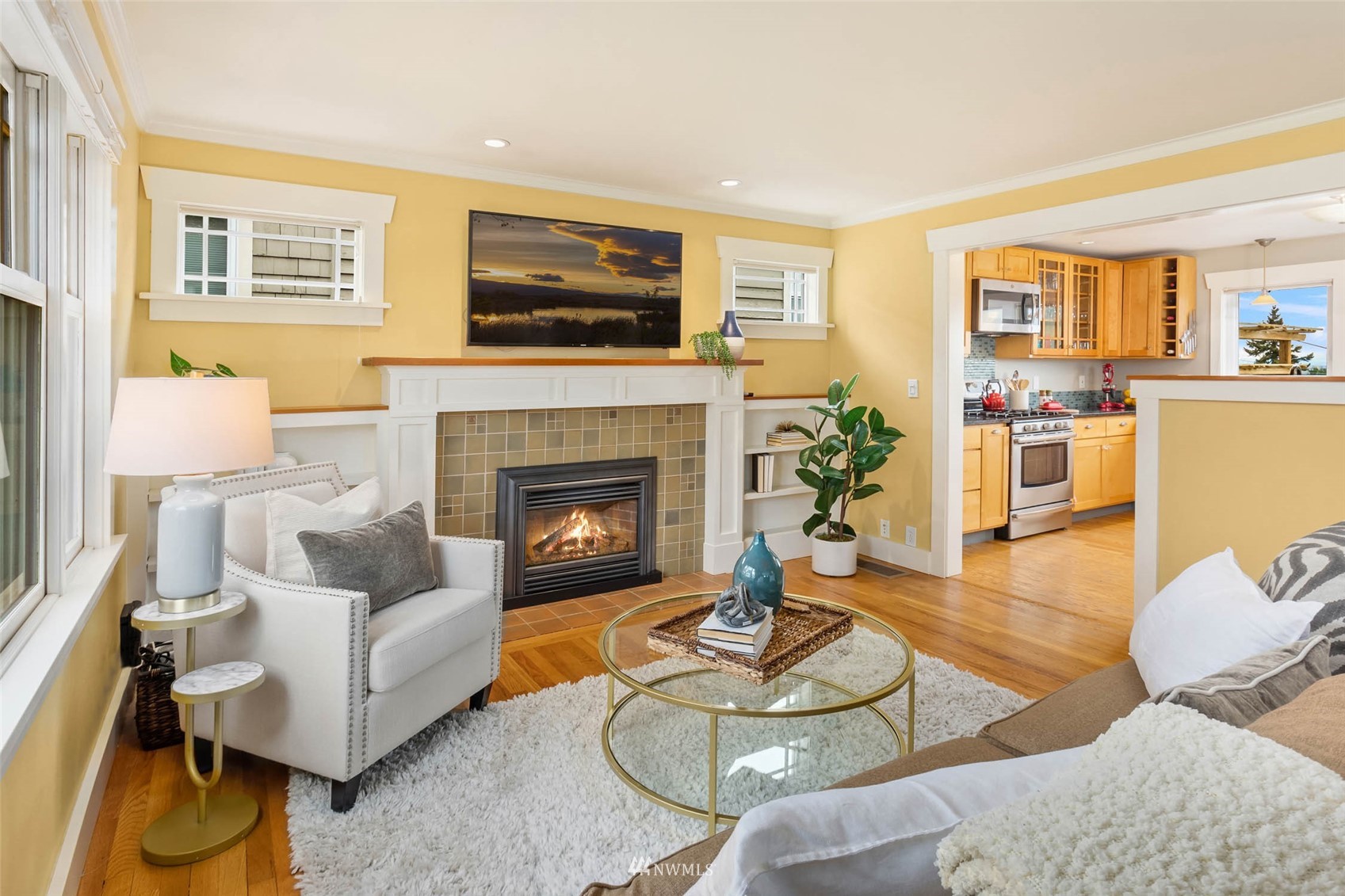 4110 38th Avenue Southwest Seattle, WA 98126 - Photo 6 of 29 a living room with furniture potted plant and a fireplace