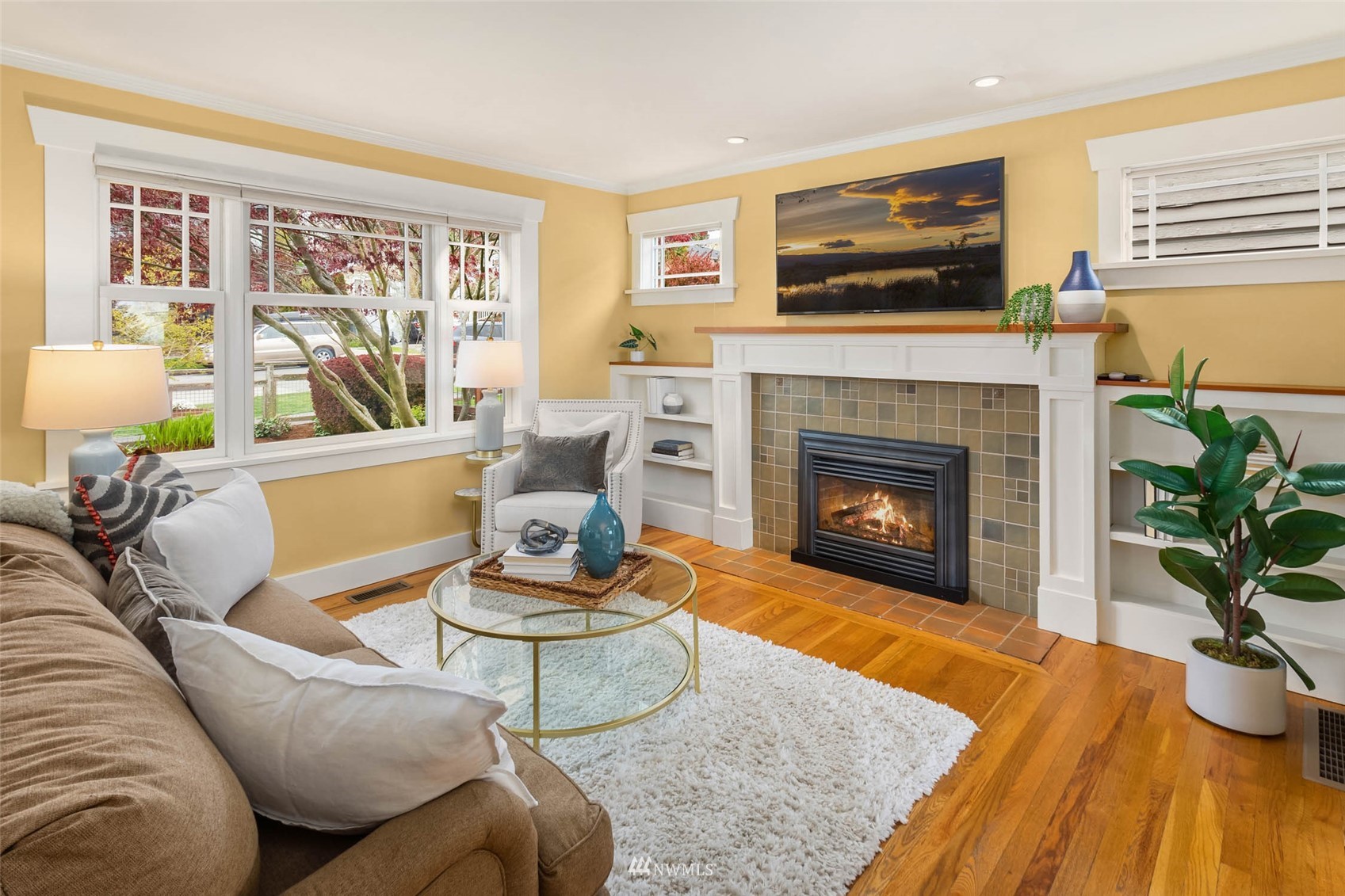 4110 38th Avenue Southwest Seattle, WA 98126 - Photo 9 of 29 a living room with furniture and a fireplace