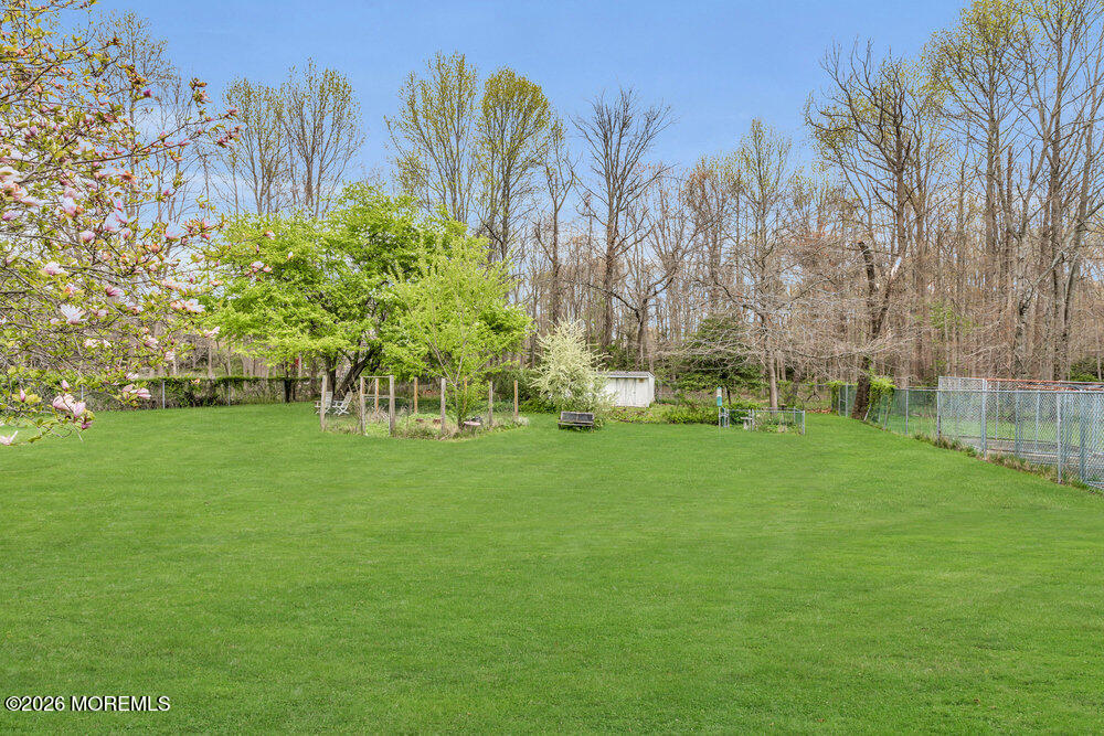 34 State Route Colts Neck, NJ 07722 - Photo 34 of 40 a garden with trees in front of it