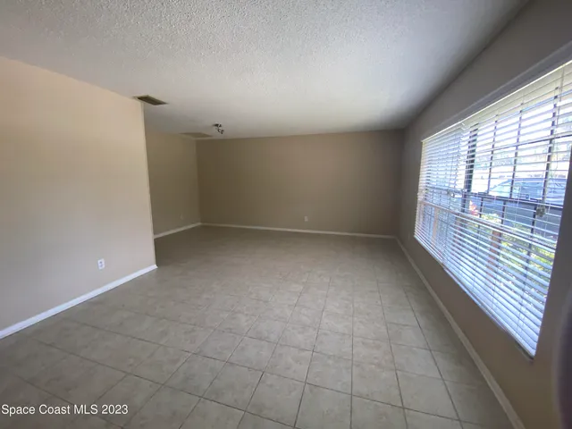 en empty room with windows