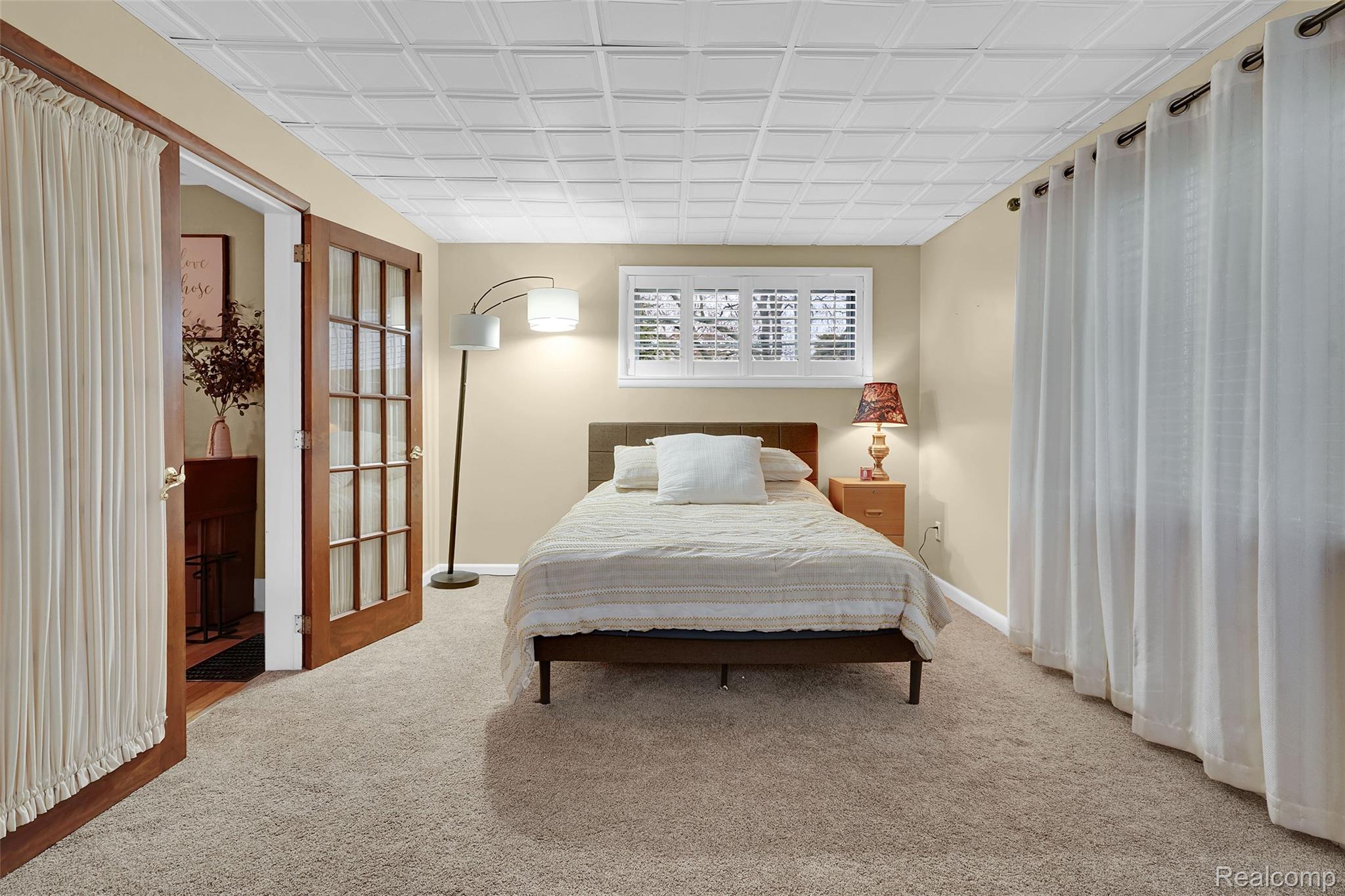 7972 3rd Street Forestville, MI 48434 - Photo 17 of 35 Bedroom featuring light carpet and baseboards