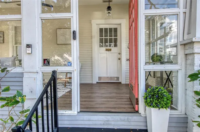 a view of front door of house with stairs