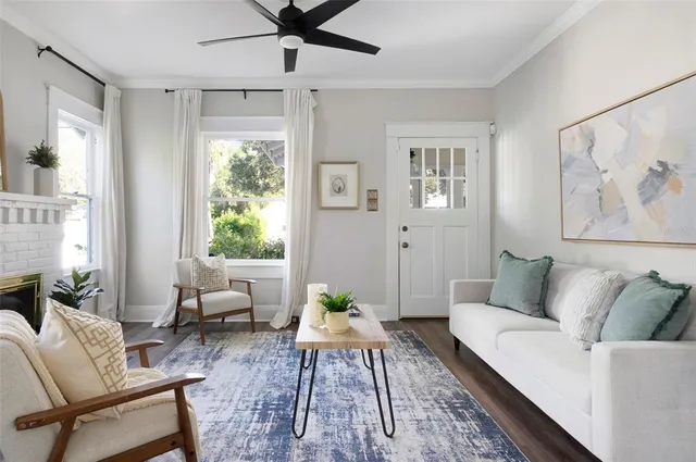 a living room with furniture and a rug
