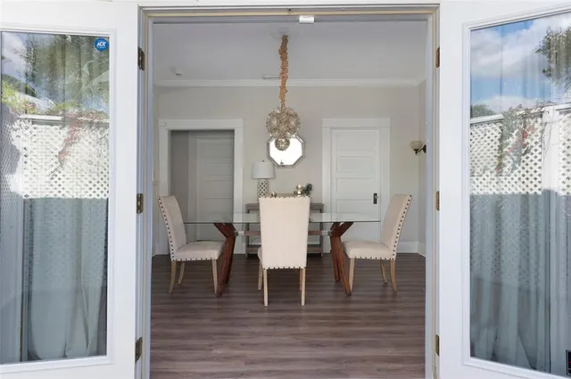 a view of a dining room with furniture and wooden floor