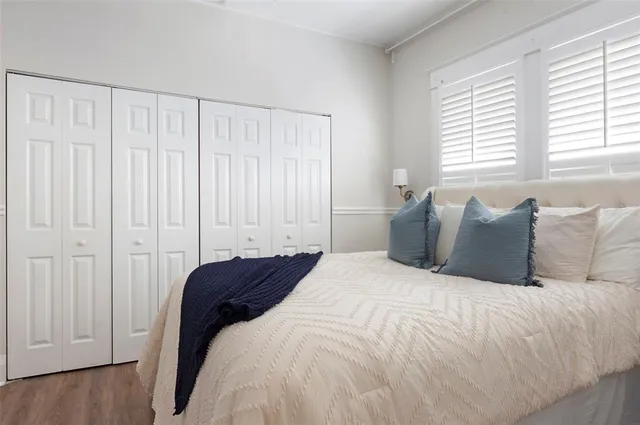 a large white bed in a white room
