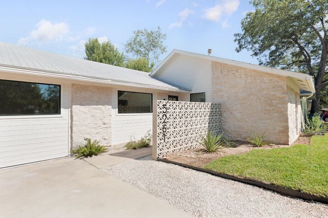 a front view of a house with a garage
