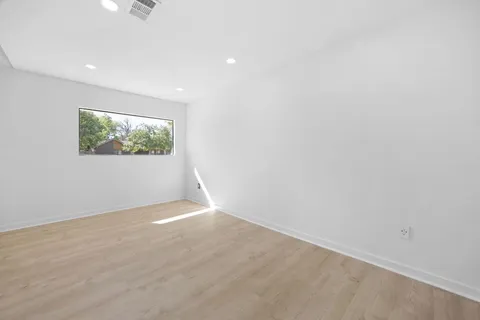 a living room with furniture and a chair