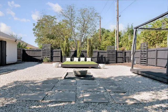 a view of road with large trees