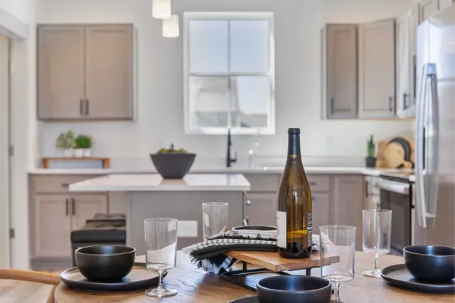 a kitchen with a sink and a stove