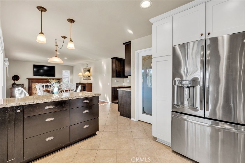 21390 Vía Del Parque Yorba Linda, CA 92887 - Photo 16 of 42 a kitchen with stainless steel appliances a refrigerator sink and cabinets