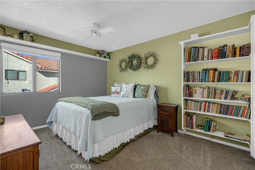 21390 Vía Del Parque Yorba Linda, CA 92887 - Photo 28 of 42 a bedroom with a bed and a book shelf
