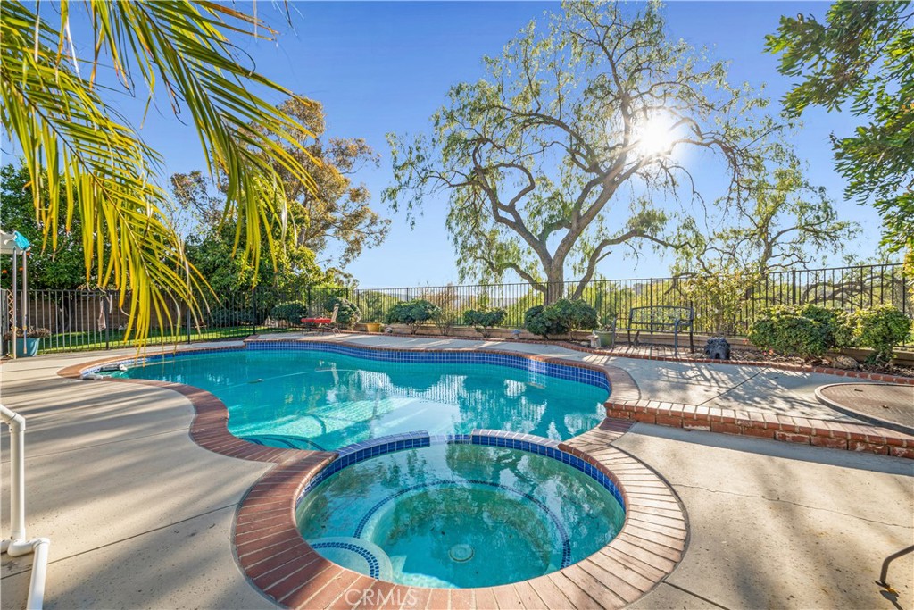 21390 Vía Del Parque Yorba Linda, CA 92887 - Photo 5 of 42 a view of a swimming pool with a yard
