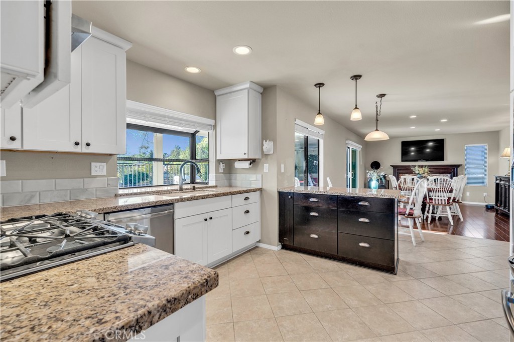 21390 Vía Del Parque Yorba Linda, CA 92887 - Photo 10 of 42 a large kitchen with stainless steel appliances granite countertop a stove a sink a refrigerator and a granite counter tops