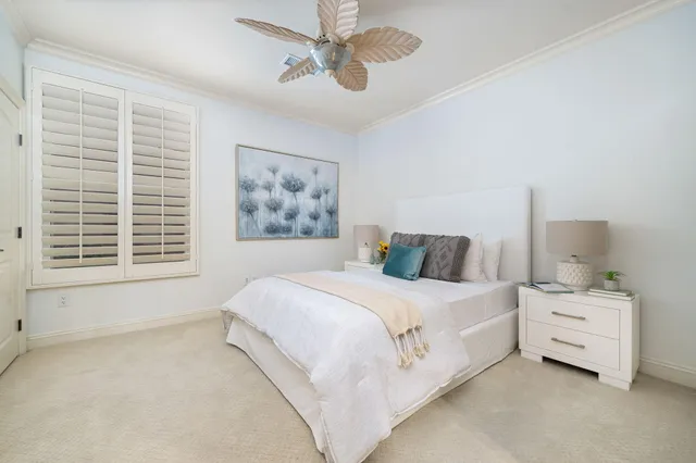 a spacious bedroom with a bed and a window