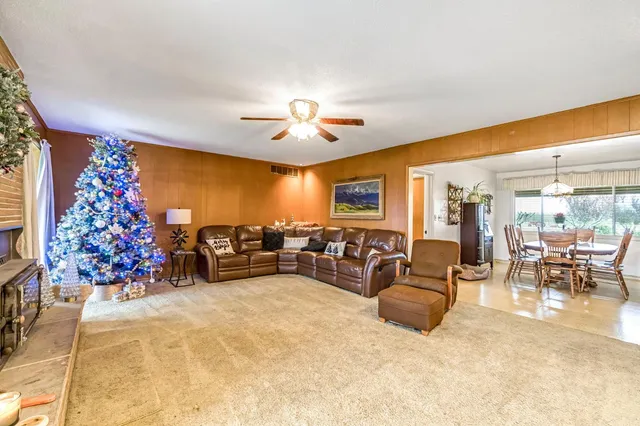a kitchen with stainless steel appliances kitchen island a white cabinets and a sink