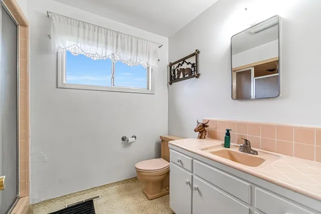 a bed room with a bed and a desk