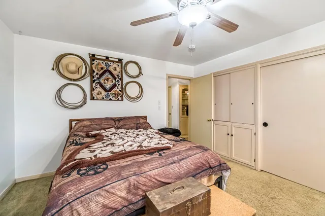 a bathroom with a tub a sink and a window