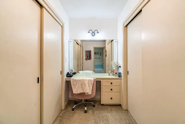 a view of a field with an trees in the background