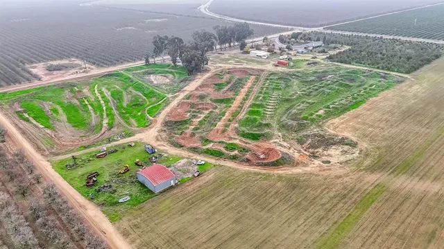 a backyard of a house with yard and outdoor seating