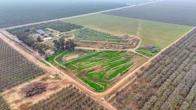 an aerial view of a house with a garden