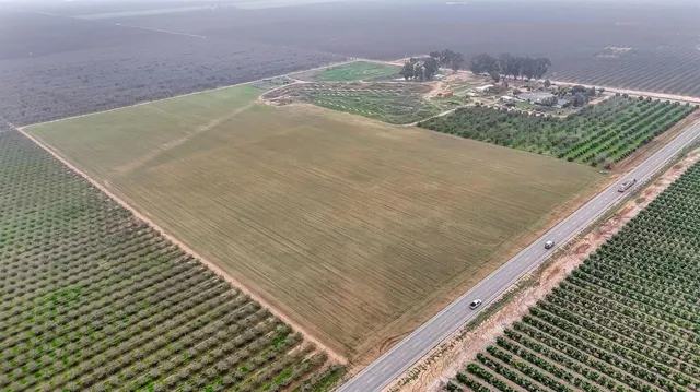 a view of a patio with a yard table and chairs