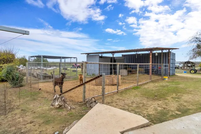 a view of a yard with an outdoor space