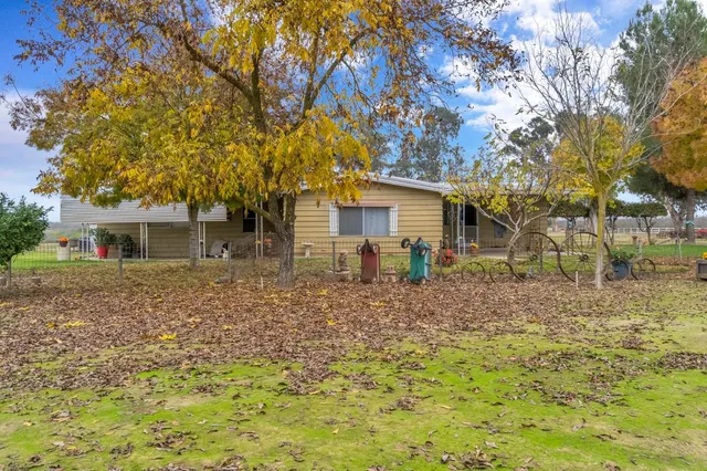 a view of a yard with an outdoor space