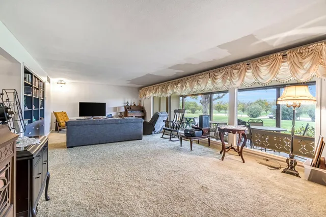 a view of a livingroom with furniture and a fireplace