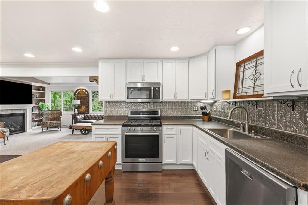 5380 Hardt Road Gibsonia, PA 15044 - Photo 11 of 49 Never worry about missing time with family and friends while preparing meals thanks to the open concept layout this home offers.