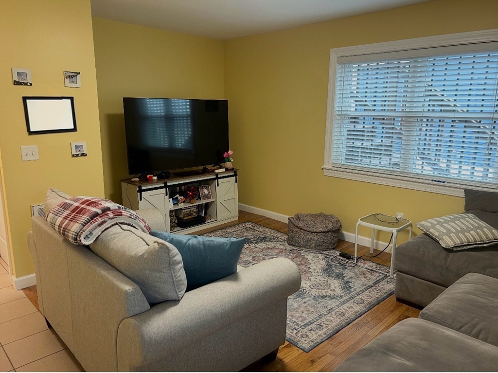 17 Proctor Street Peabody, MA 01960 - Photo 7 of 13 a living room with furniture and a flat screen tv