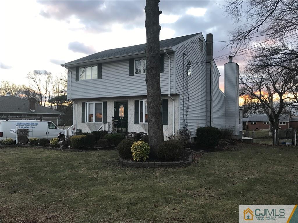 93 Magnolia Road Iselin, NJ 08830 - Photo 1 of 25 a front view of a house with garden