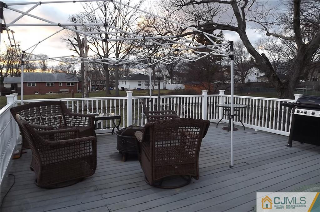 93 Magnolia Road Iselin, NJ 08830 - Photo 25 of 25 a view of balcony with wooden floor and outdoor seating