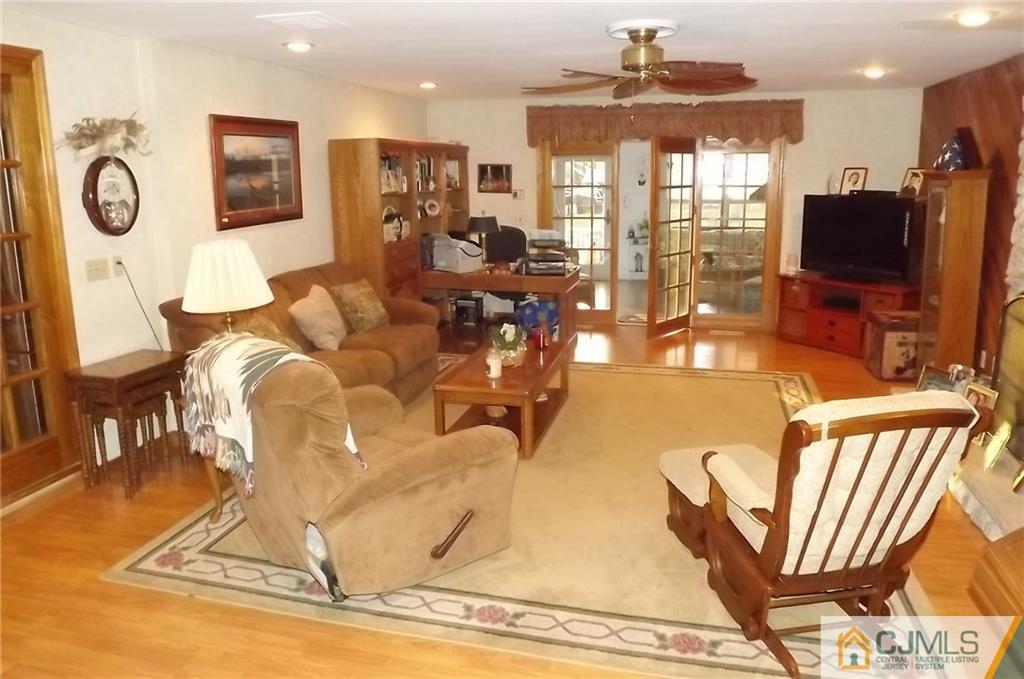 93 Magnolia Road Iselin, NJ 08830 - Photo 4 of 25 a view of a livingroom with furniture window and wooden floor