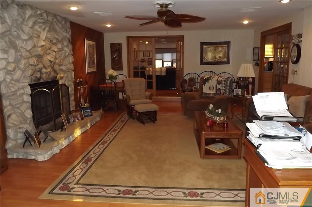 93 Magnolia Road Iselin, NJ 08830 - Photo 5 of 25 a living room with furniture and a fireplace