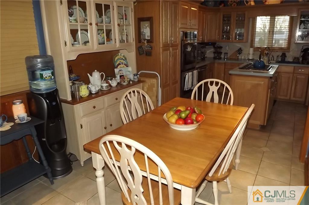 93 Magnolia Road Iselin, NJ 08830 - Photo 8 of 25 a view of a dining room with furniture