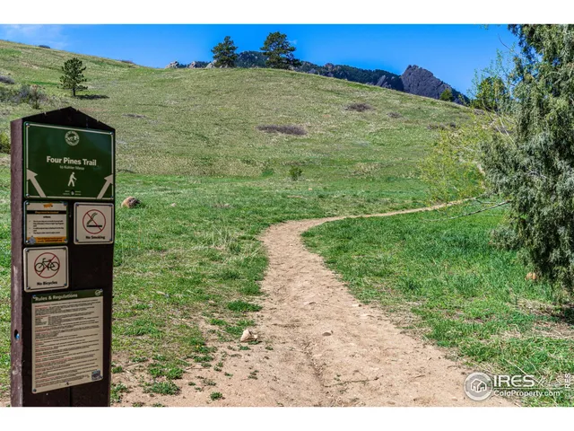 a view of a pathway of a building with a yard