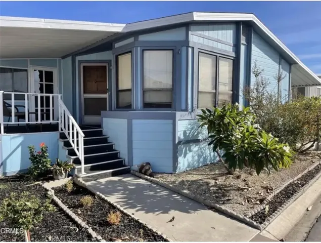 a front view of a house with stairs