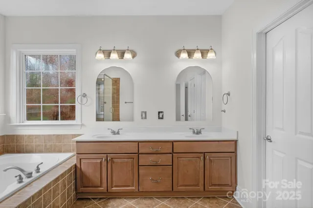 a bathroom with a bathtub and shower
