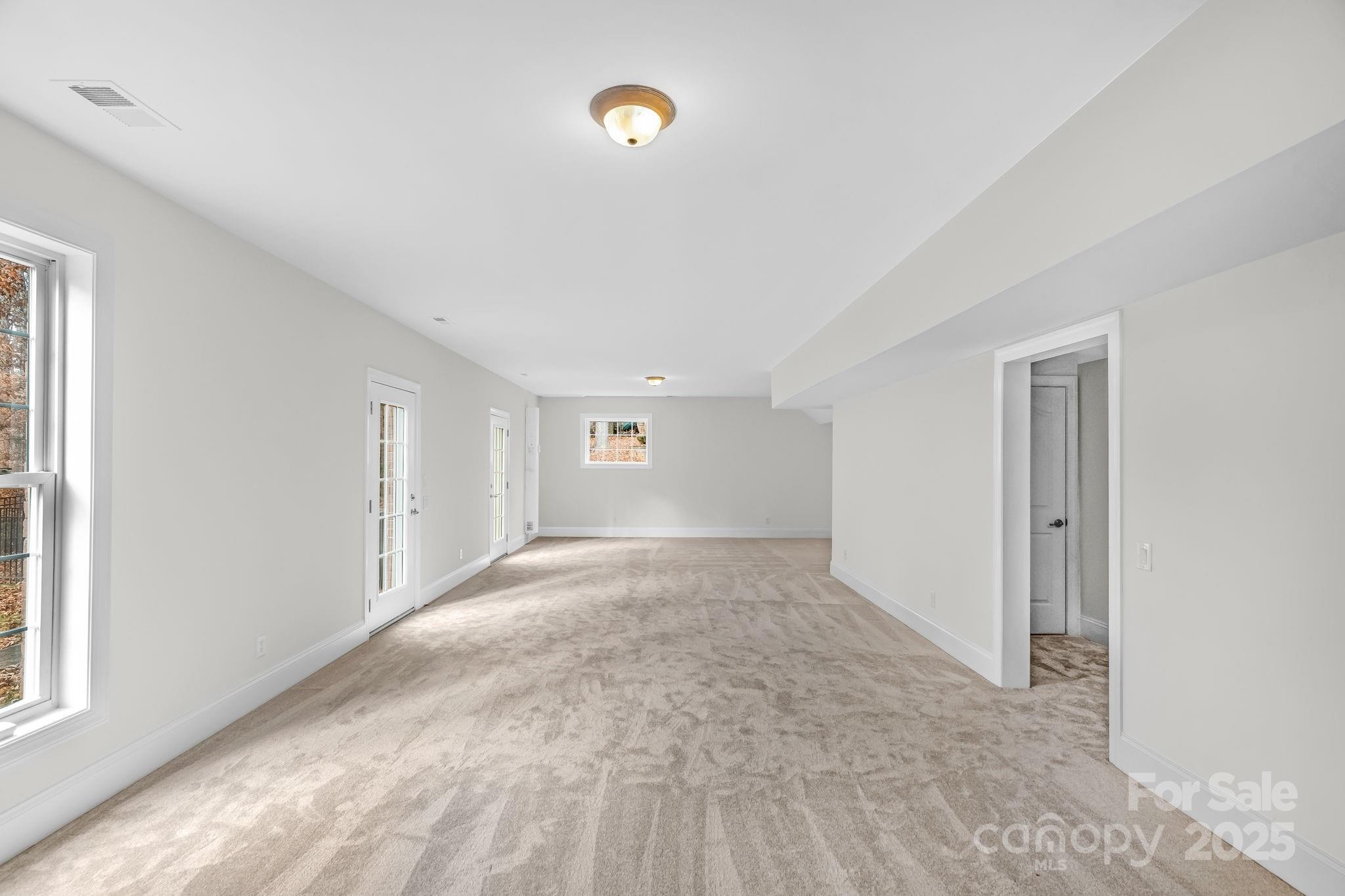 1300 Longleaf Court Weddington, NC 28104 - Photo 26 of 48 a view of empty room with windows