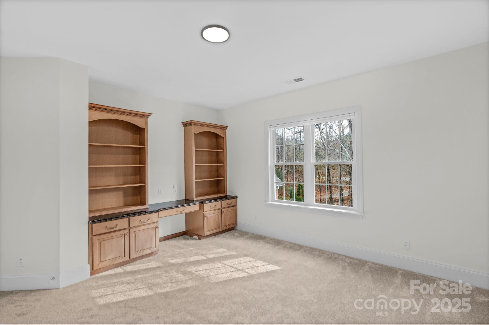 1300 Longleaf Court Weddington, NC 28104 - Photo 32 of 48 an empty room with windows