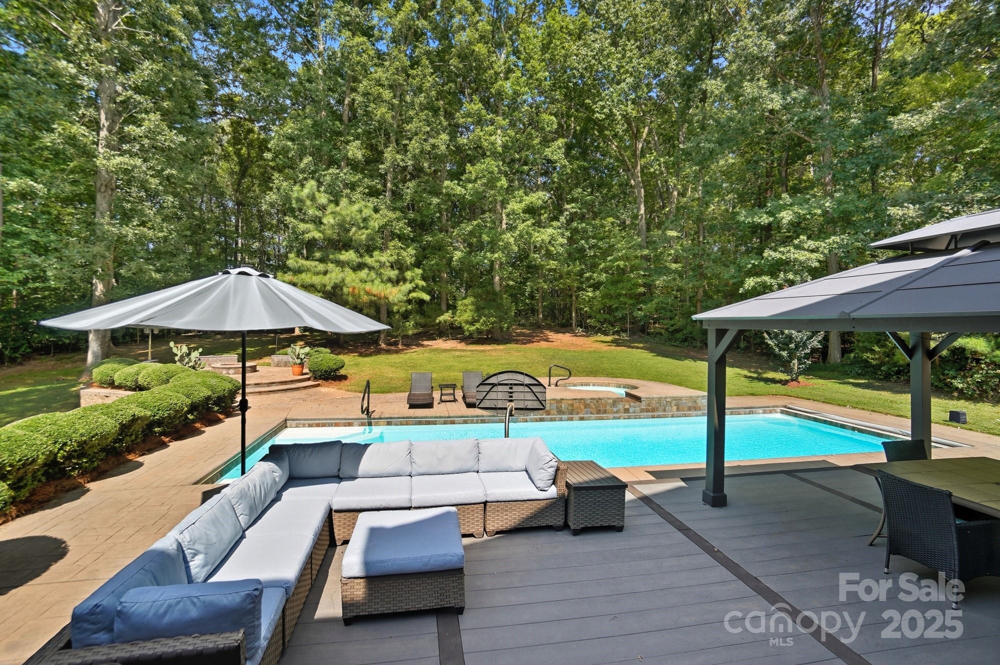 1300 Longleaf Court Weddington, NC 28104 - Photo 42 of 48 an outdoor space with furniture and umbrella