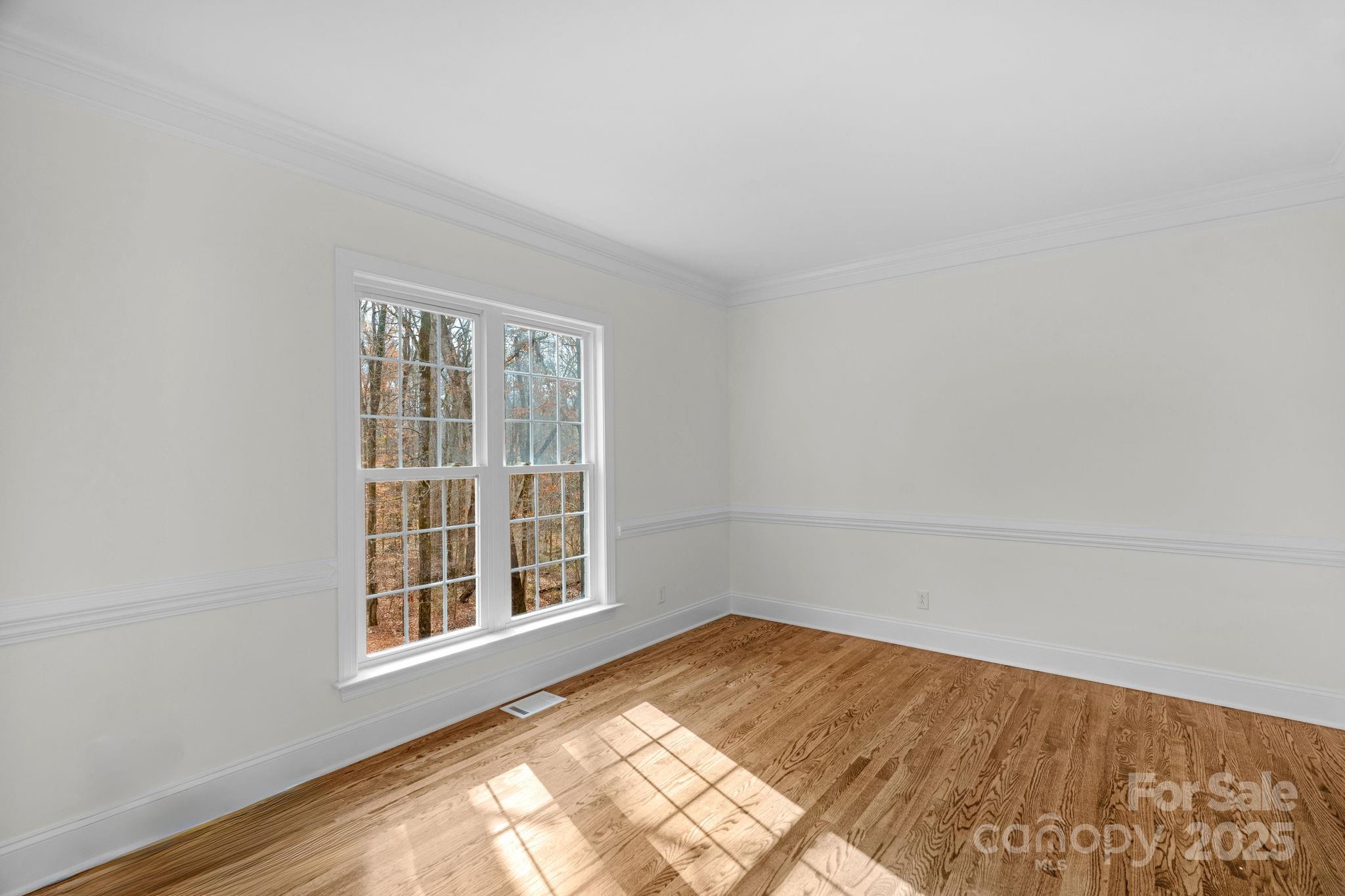 1300 Longleaf Court Weddington, NC 28104 - Photo 8 of 48 an empty room with a window