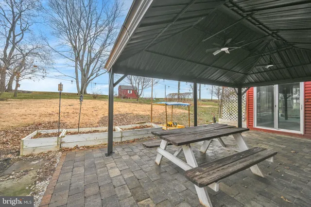 a view of a swimming pool with outdoor seating