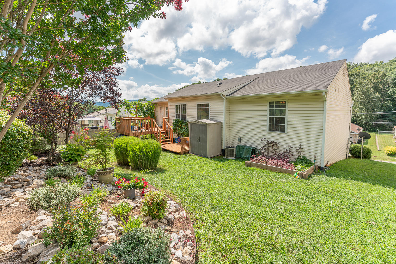 4245 Daugherty Road Salem, VA 24153 - Photo 2 of 44 a view of a backyard with plants and a patio